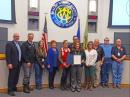 The Washoe County Proclamation Ceremony: ARRL Washoe County Emergency Coordinator Bob Miller WA6MTY, is at the far right-hand side.